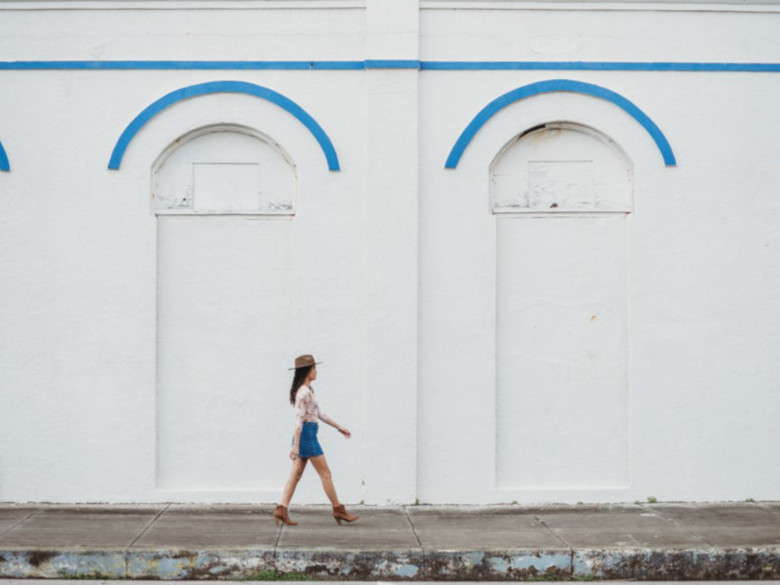 Strong girl walk down the street confidently